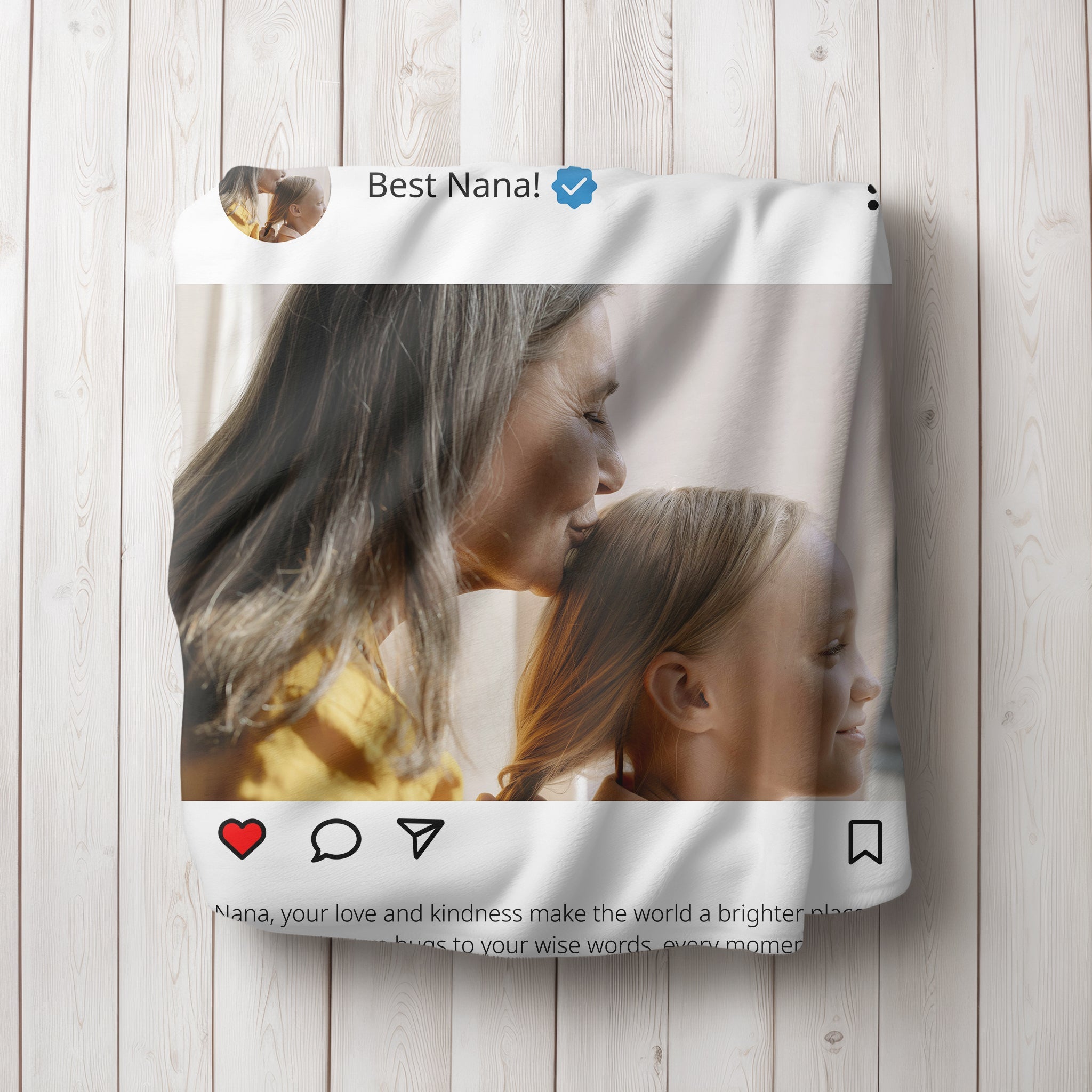 Personalized light themed instagram post blanket with grandma and grandchild, folded up on the floor.